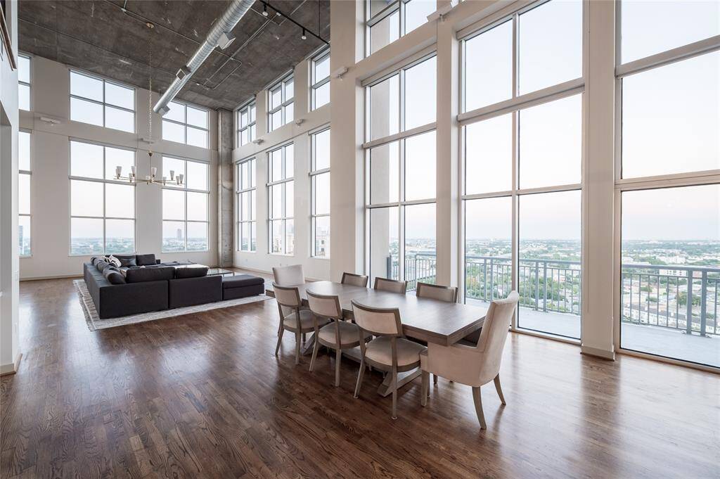 Step into this two-story industrial-style loft penthouse in the heart of Houston, where floor-to-ceiling windows flood the space with natural light and city views. A rare blend of modern luxury and urban edge.