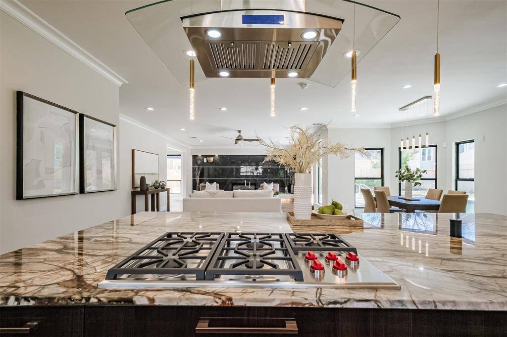 Enjoy this great view of the expansive living area from the kitchen. (previously staged)