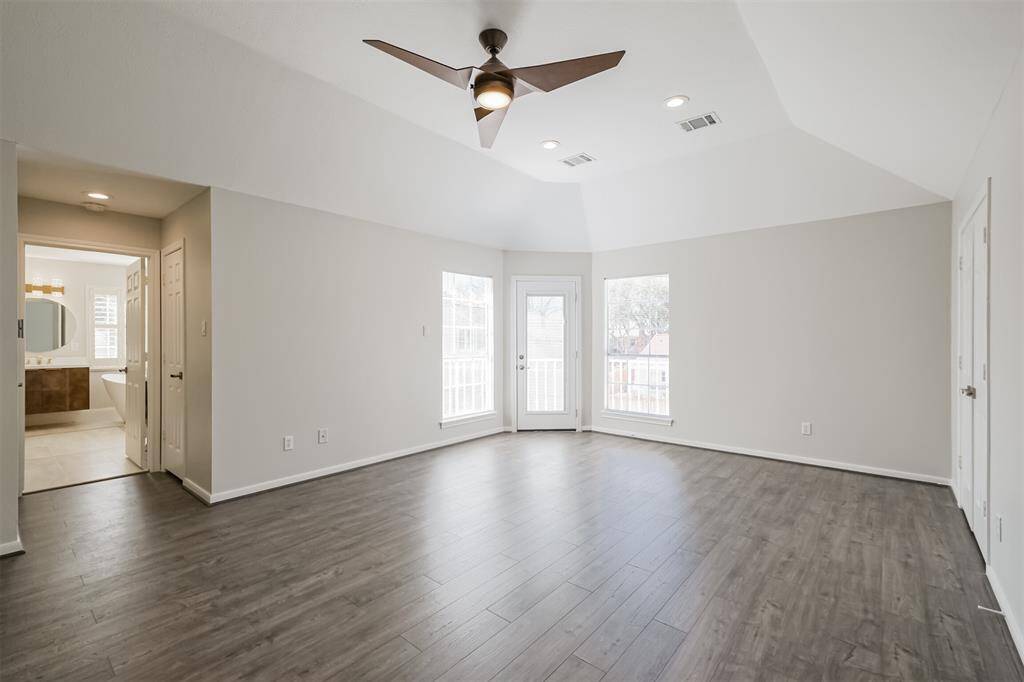 Welcome to your expansive primary bedroom, where high ceilings elevate the sense of space and grandeur. This luxurious sanctuary boasts not one, but two generous closets, offering ample storage. Step out onto your private balcony and take in the serene view of the glistening pool below—a peaceful retreat for those quiet moments of reflection.