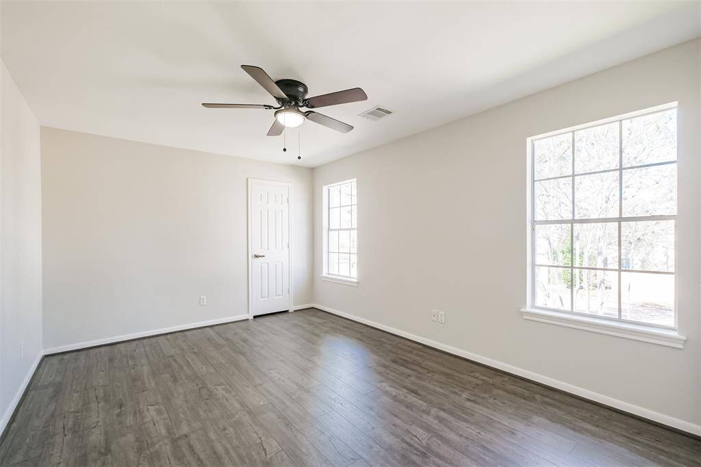 The secondary bedrooms in this home are very large and offer a lot of storage! All secondary bedrooms feature easy to maintain laminate wood flooring, ceiling fans and solid core doors.