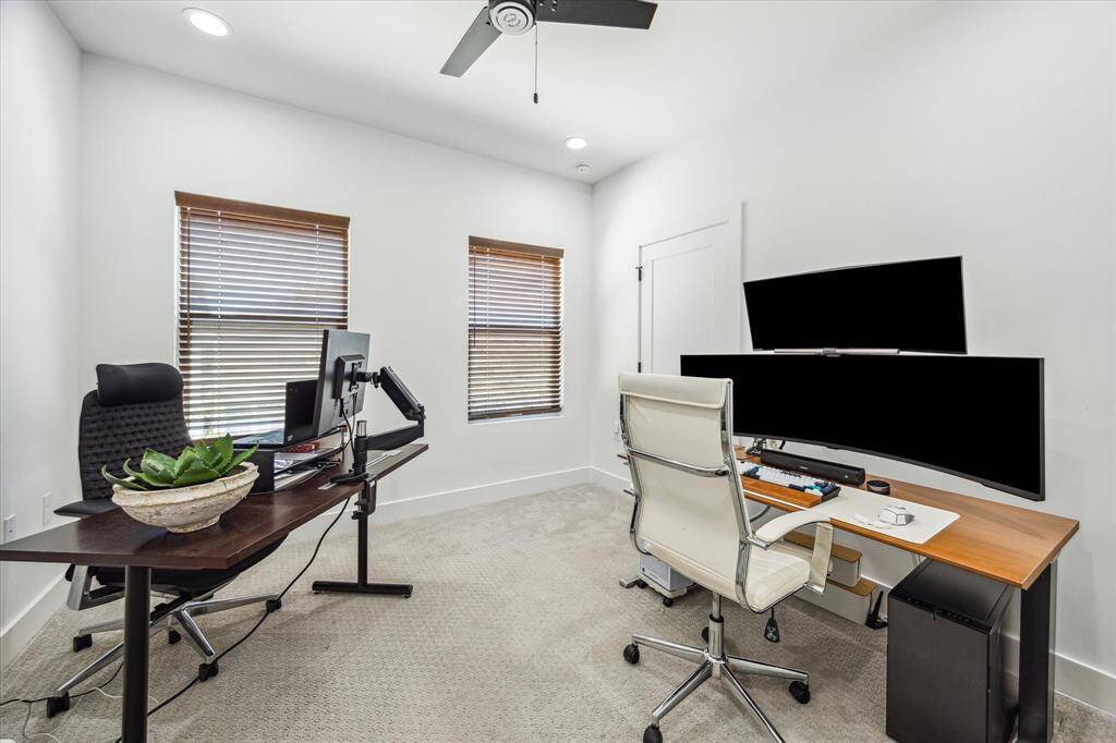 Secondary bedroom on the third floor currently used as an office.