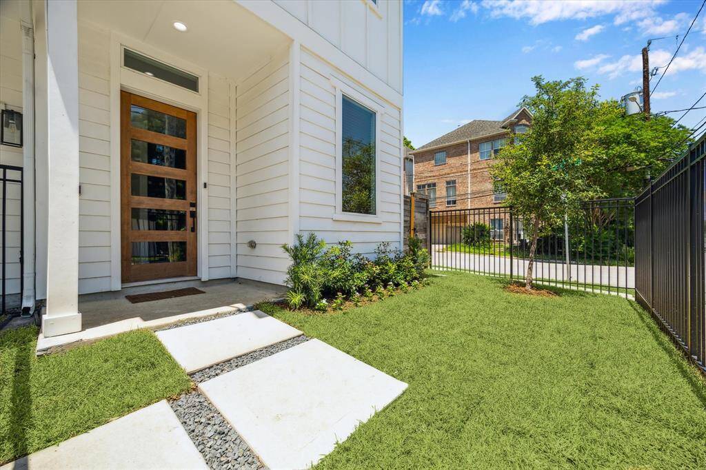Fully fenced front yard with beautiful landscaping!
