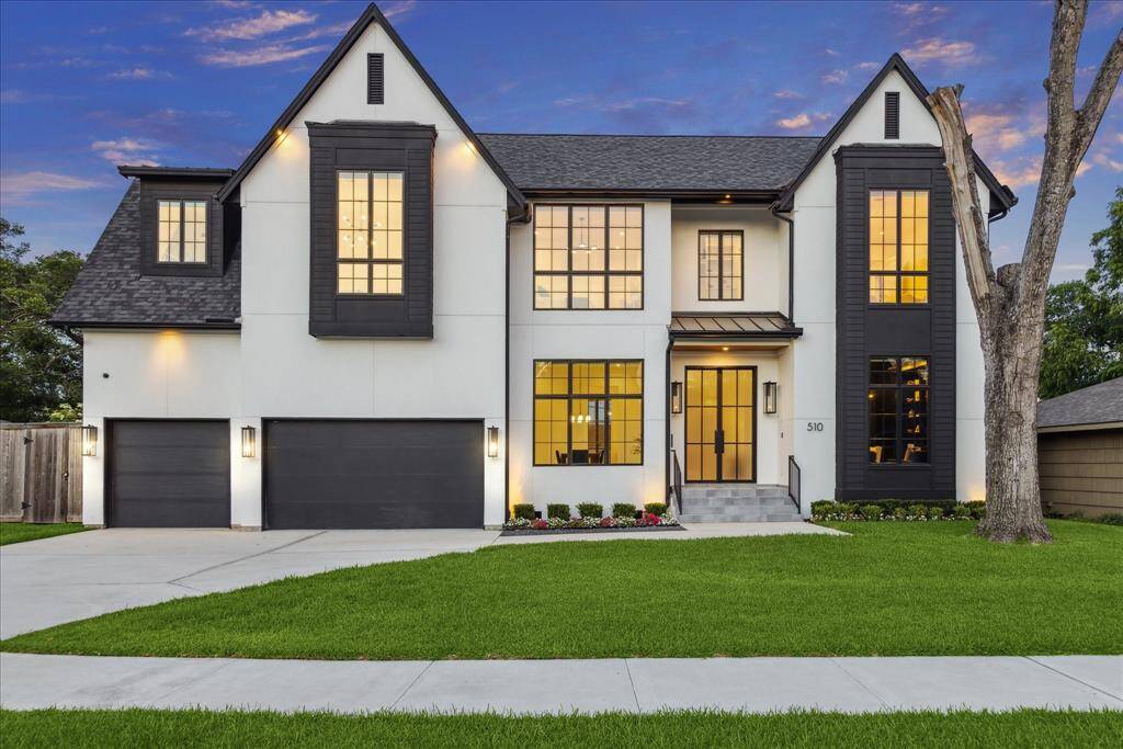[FRONT ELEVATION] A striking French Contemporary façade welcomes you with a sophisticated blend of dark siding and crisp white stucco, creating bold contrast and modern elegance. Expansive French windows add timeless charm while flooding the interior with natural light, offering a seamless connection between classic European design and sleek contemporary style.