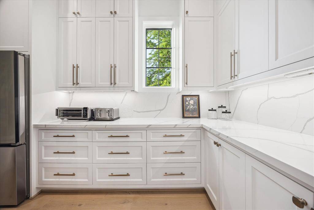 This space goes beyond ample storage, featuring dedicated counter space ideal for small appliances and meal prep.