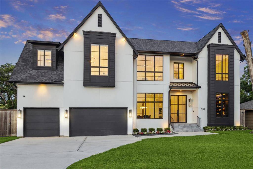 A spacious three-car garage is seamlessly integrated into the façade, offering both convenience and style without compromising the home’s sophisticated presence.