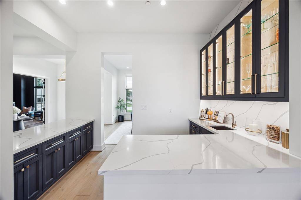Perfectly positioned for effortless hosting, this thoughtfully curated area elevates everyday living with contemporary elegance