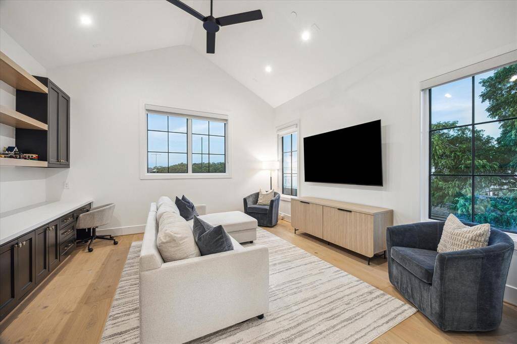 [GAME-ROOM] Upstairs, the spacious game room offers the perfect setting for entertaining, movie nights, and relaxed gatherings. With its open layout and contemporary design, this versatile space is ideal for creating lasting memories