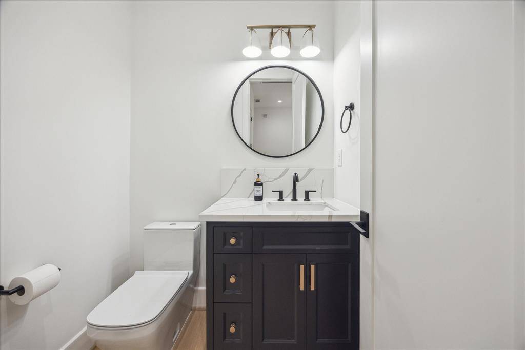 [POWDER ROOM 2ND FLR] Conveniently located just off the game room, the second-floor powder room offers both style and ease for guests.