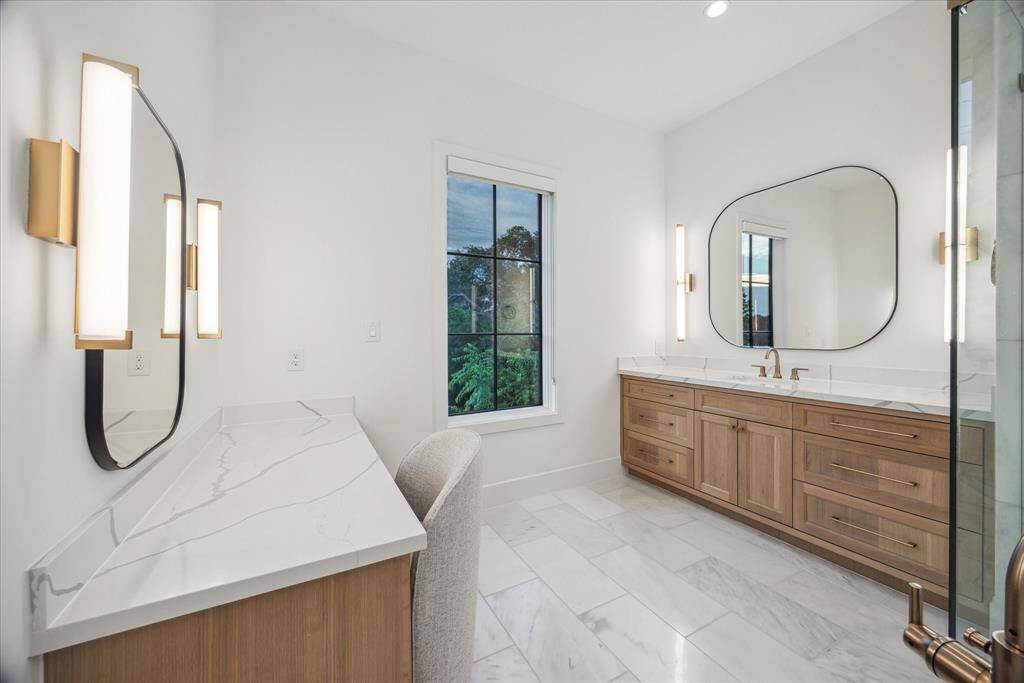 An additional luxurious feature, the dedicated makeup vanity offers an elegant and private space designed for beauty and self-care. Thoughtfully appointed with exquisite lighting and sleek surfaces, it provides a serene retreat where daily routines become moments of indulgence.