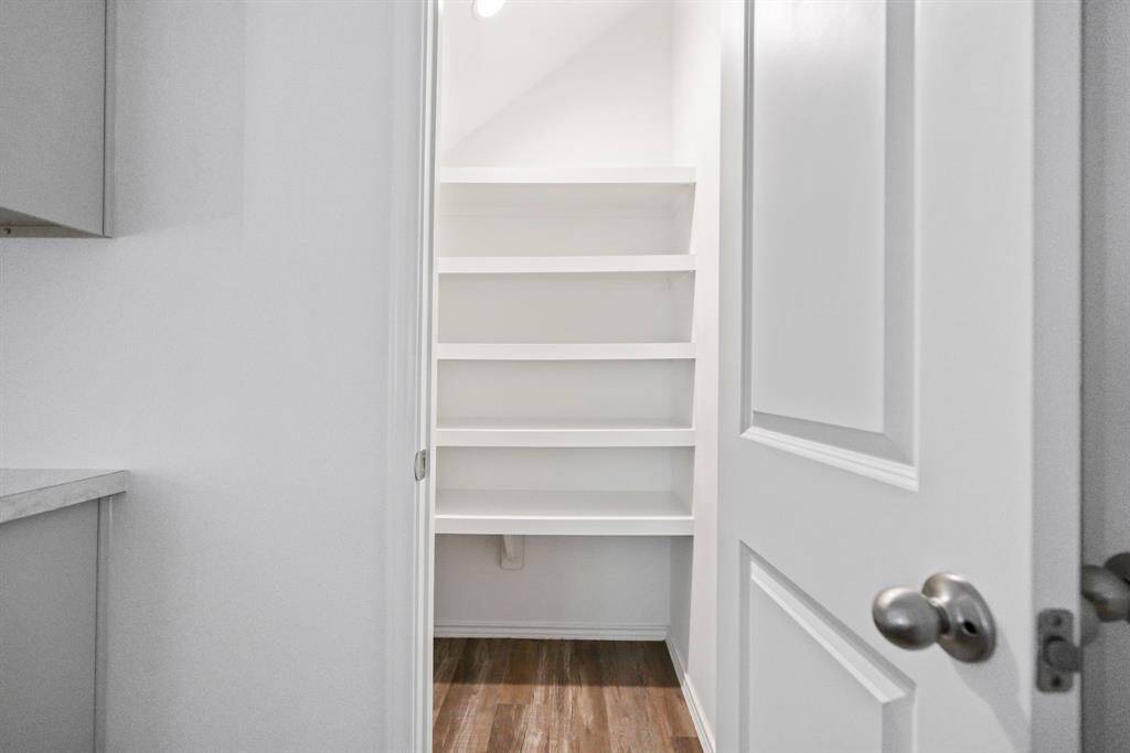 Spacious walk-in pantry—perfect for all your kitchen essentials.