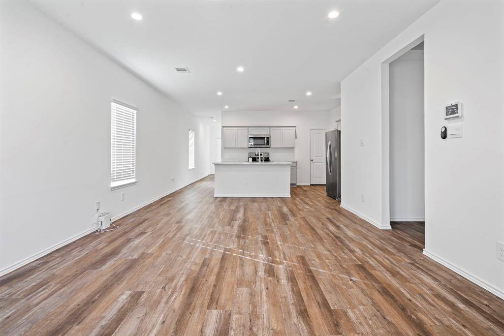 Modern open concept layout—perfect for effortless entertaining.