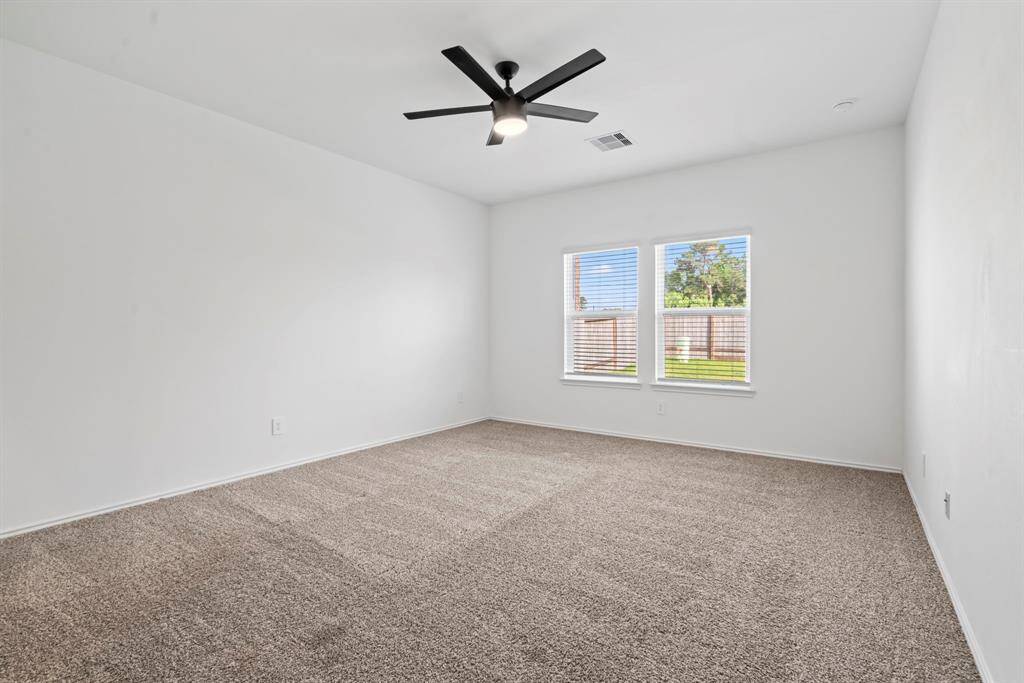 Spacious master bedroom with soft ambient lighting