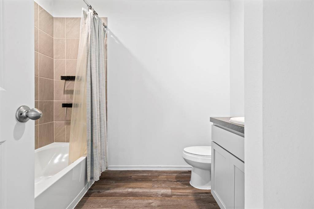 Additional view of upstairs bathroom with tiled shower/tub combo