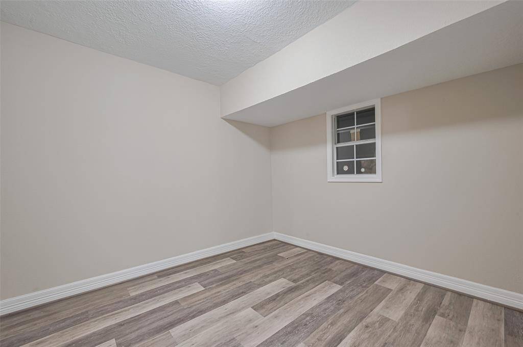 This fourth bedroom echoes the design continuity while offering the kind of adaptable space that easily shifts with changing needs.