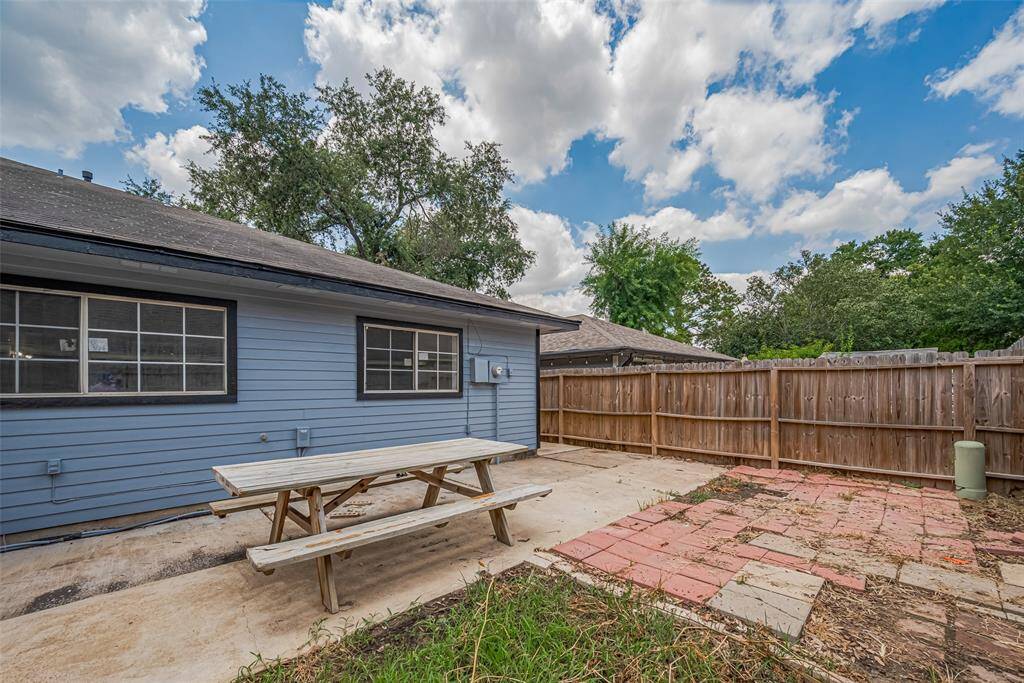 A full fence encloses the backyard with privacy and peace.