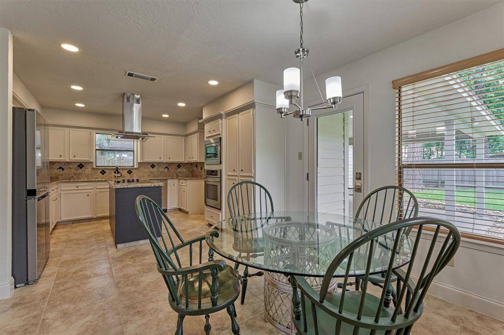 The breakfast room adjoins the kitchen and overlooks the backyard!