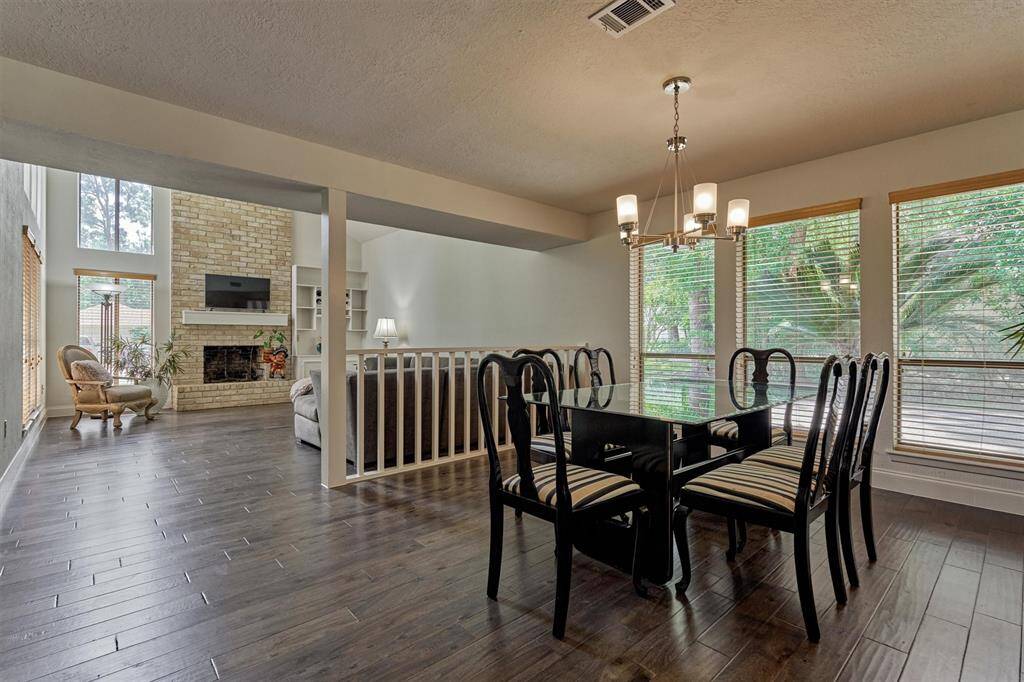 The formal dining room is open to the Den with passthrough to kitchen - making for ease of entertaining.
