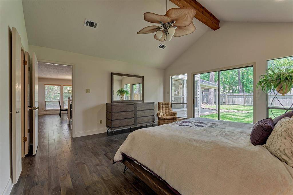 An abundance of space and natural light in the primary retreat. You'll love having direct access to the backyard!