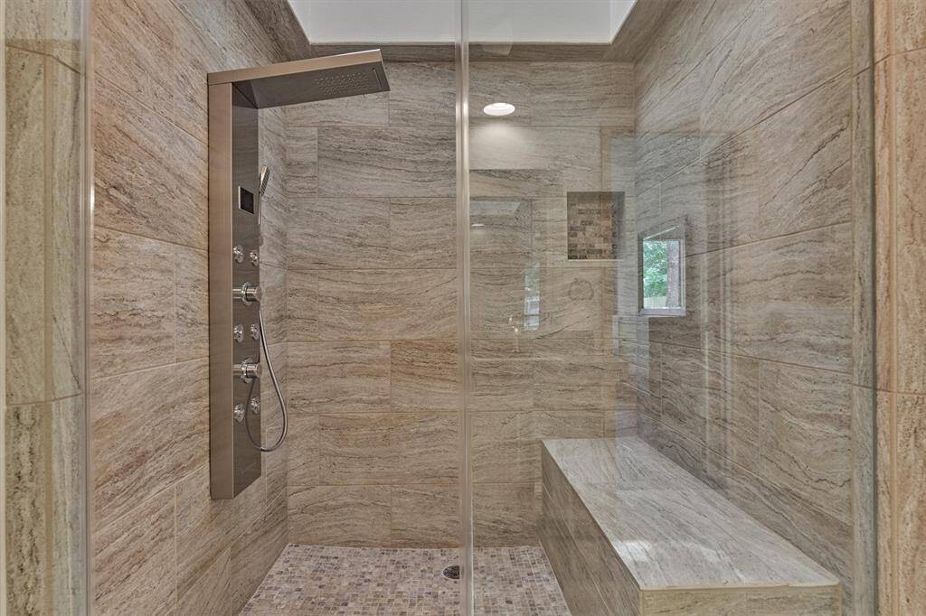 This luxurious XL shower has built-in bench and brand new shower head!