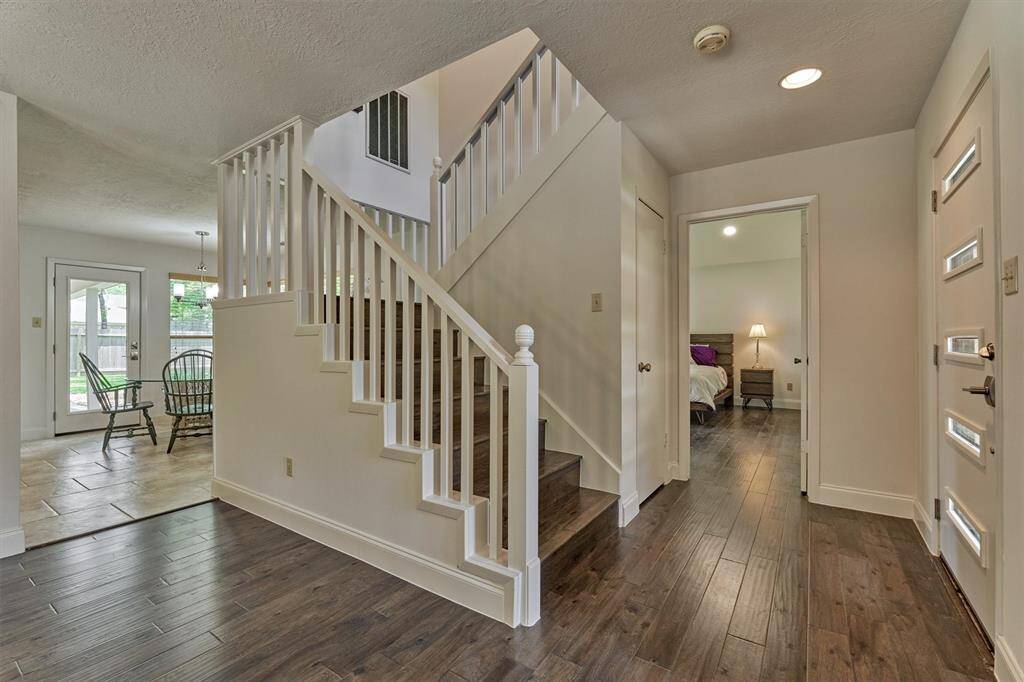 Note the wood treads on the staircase and hard surface floors throughout the main floor!