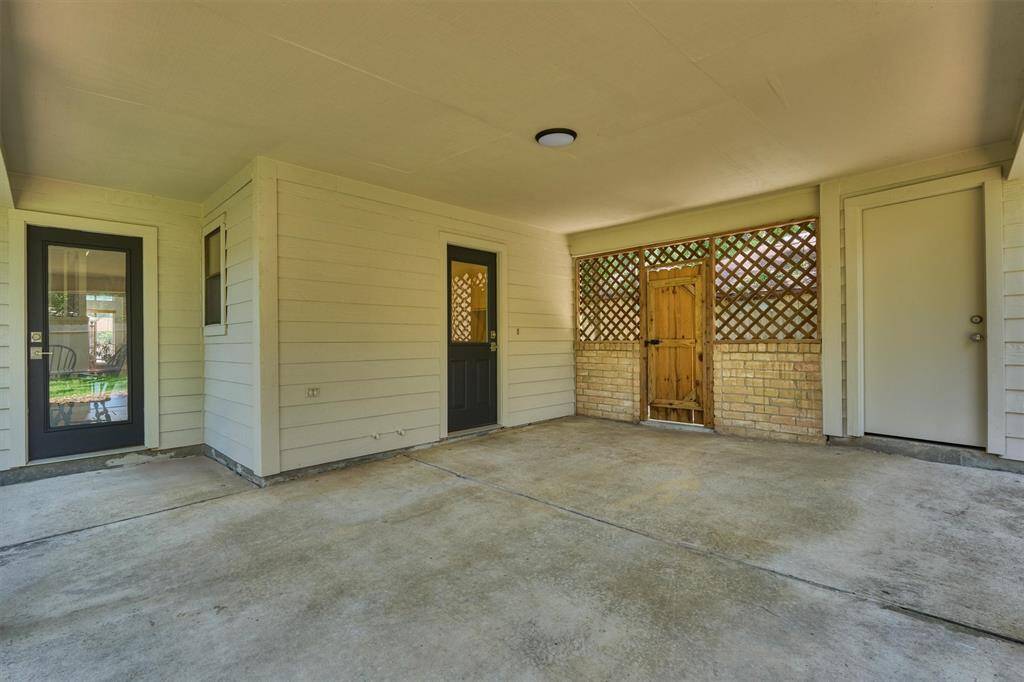The covered patio will make trips to the garage easy. Bring your outdoor grill!
