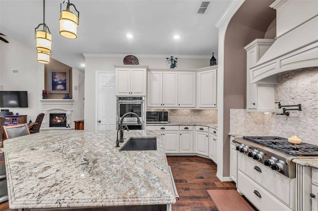 The kitchen island is where people always gather.  This one is a showstopper!