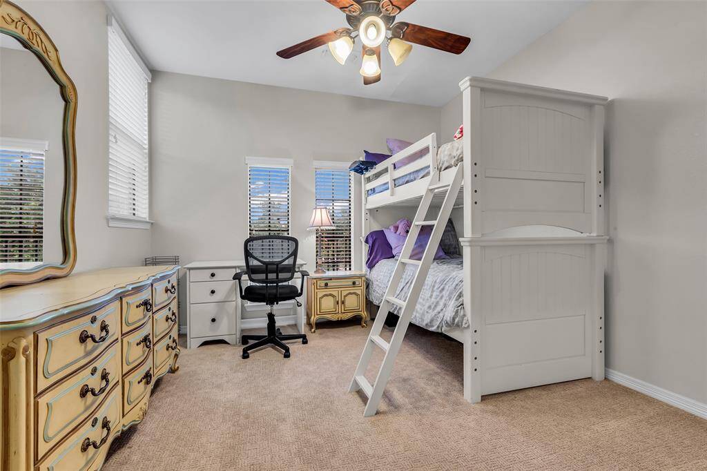 This bedroom is adjacent to the media room at the top of the stairs.
