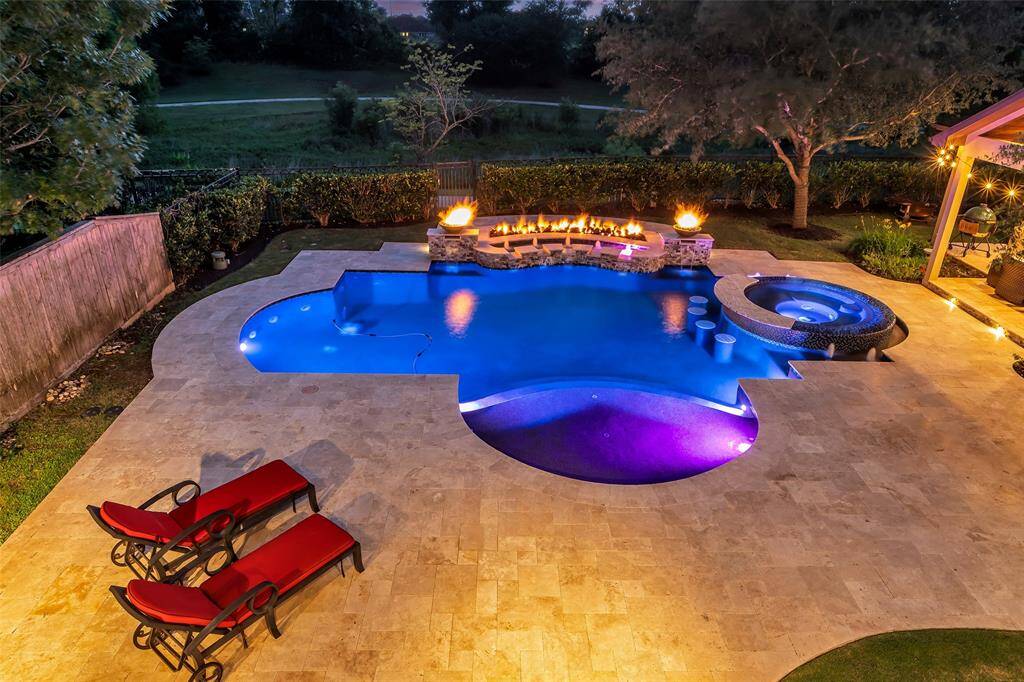 Aerial view of the pool and spa from the game room balcony.