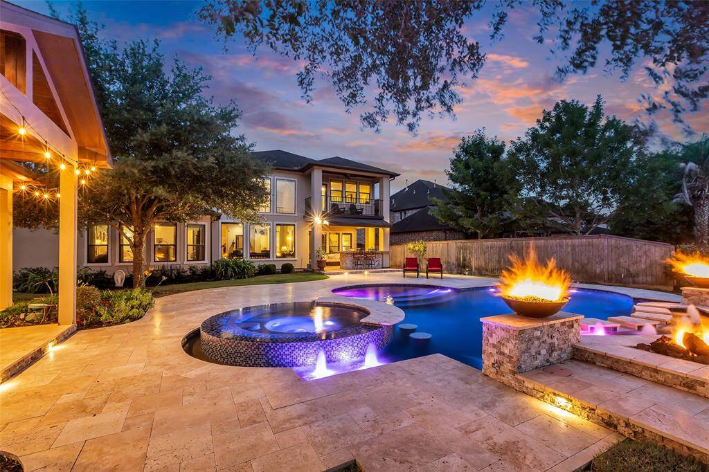 The fire bowls and outdoor lights make this home sparkle.