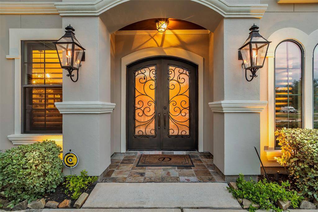 Welcome your guests in style. Beautiful iron and glass door sets the tone for the casual elegance that is about to unfold.