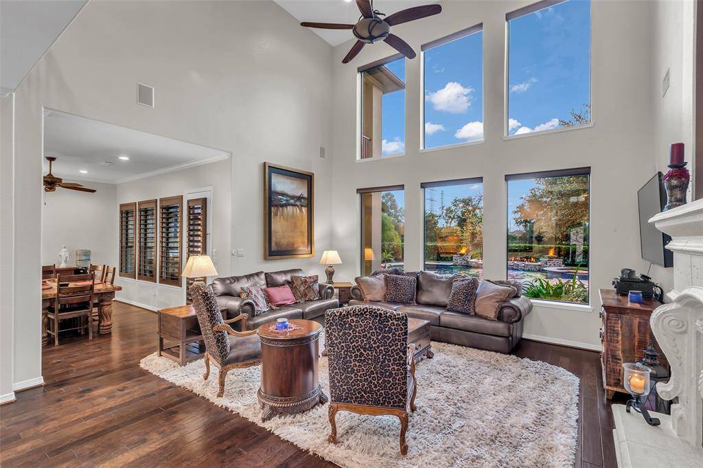 Two story family room boasts incredible pool views.