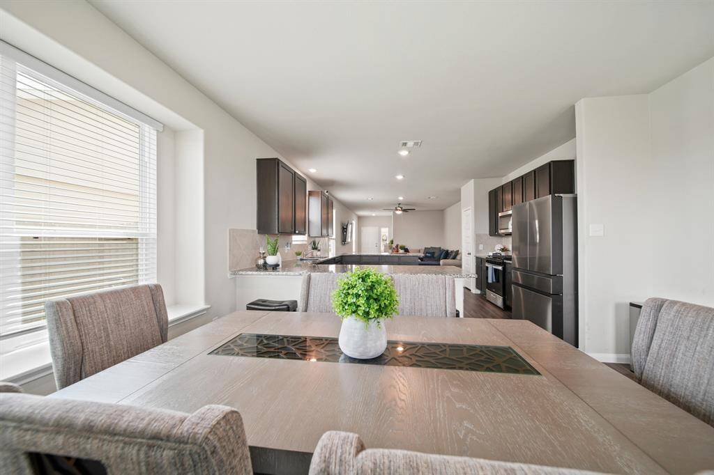 Another view showcasing how thoughtfully designed the open-concept first floor is. Absolutely stunning!