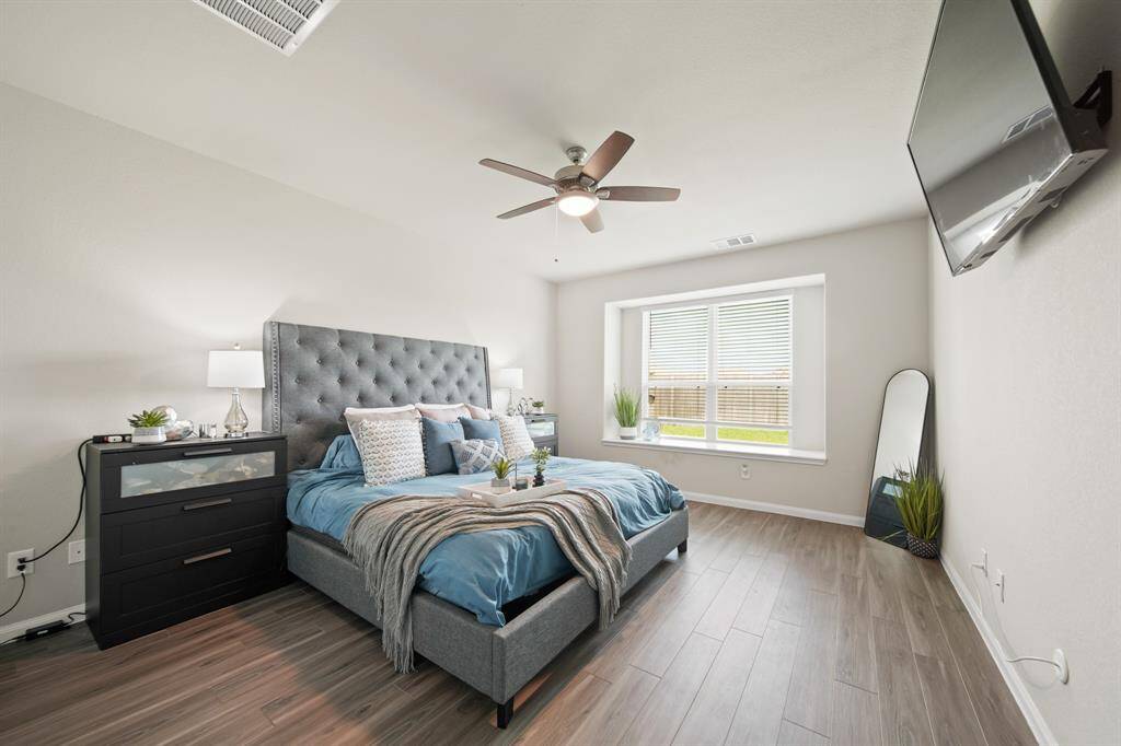 The Primary Suite is on the first floor, is generously sized and features the beautiful LVP flooring.