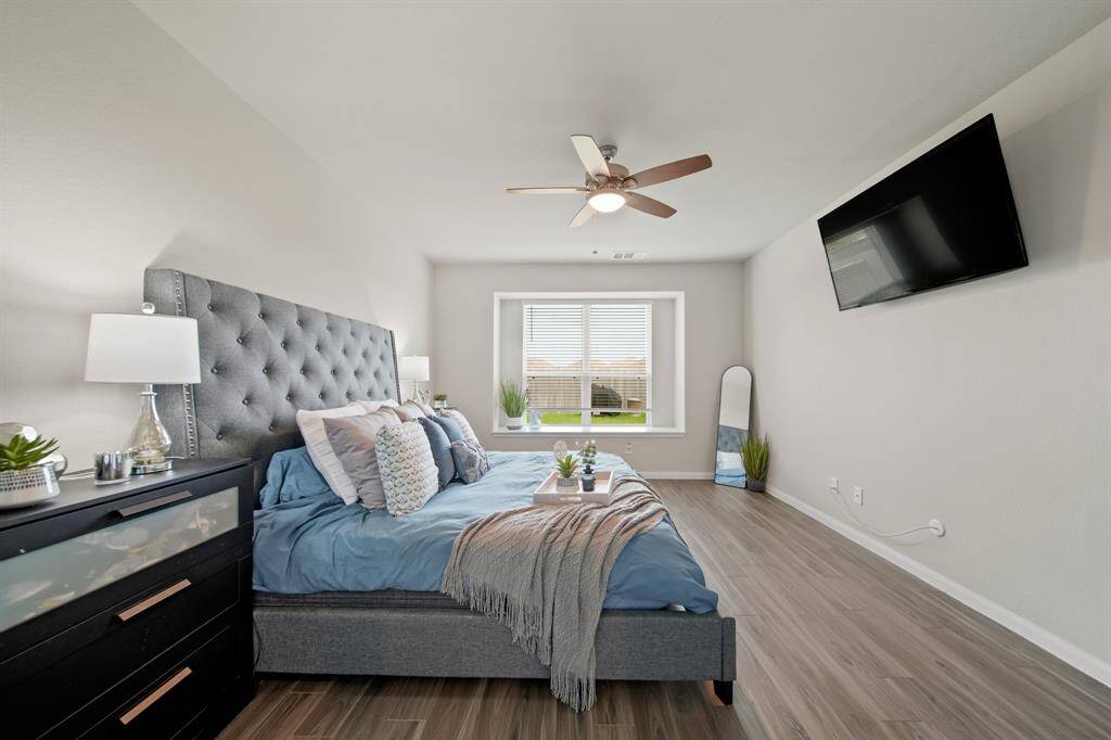 Another view of the Primary Suite. Notice the wonderful window seat and the TV is included.