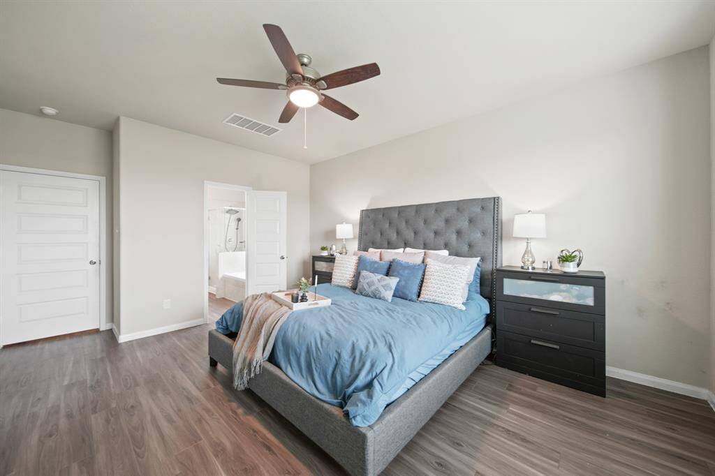 What a lovely retreat to start and end your day in this spacious and private Primary Suite with Ensuite, featuring gorgeous LVP floors and a modern fan with light. (Room is staged with a king-sized bed with large headboard and 2 night stands.)