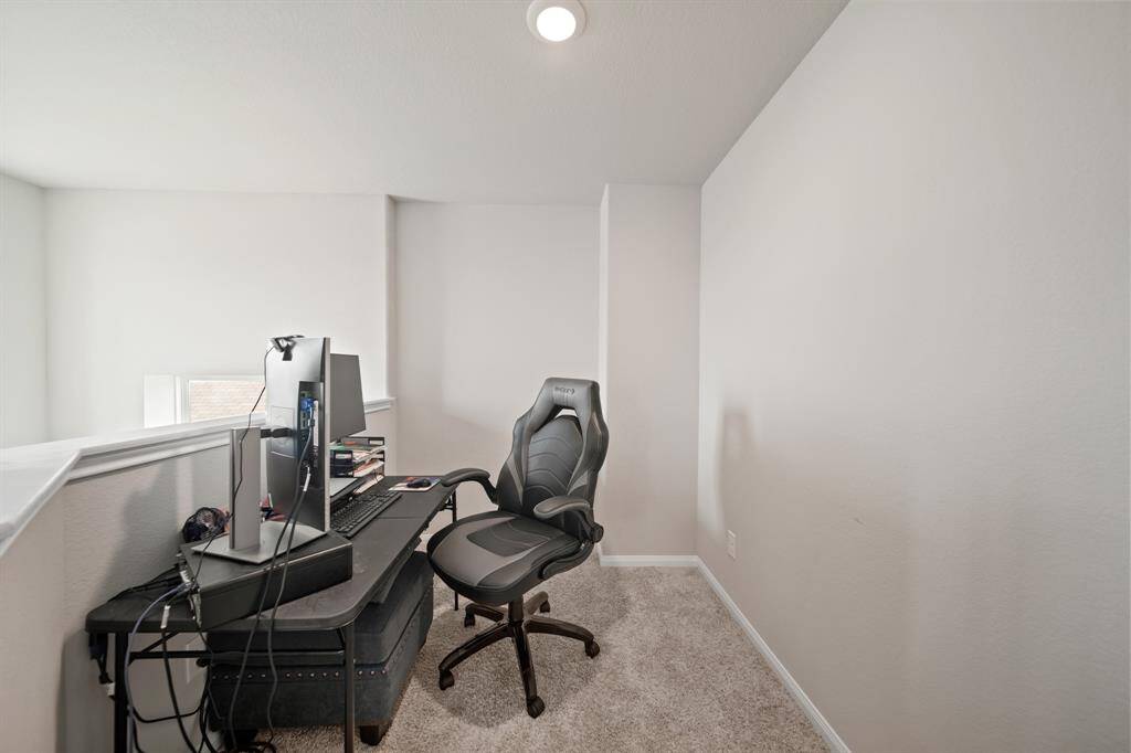 Across from the game room is this extra space. Currently being used as an office -- but could be a study nook, reading nook or small play area -- so many options especially.