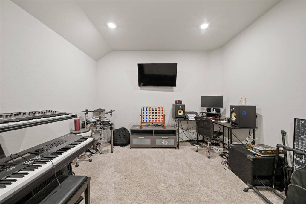 The media room is very spacious and could easily accommodate large furniture -- perfect for movie nights!