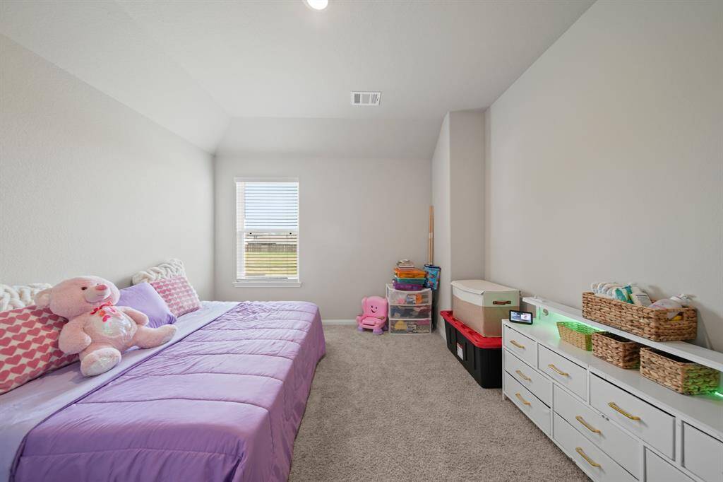 Another view of Bedroom #4 featuring LED lighting and a large window.