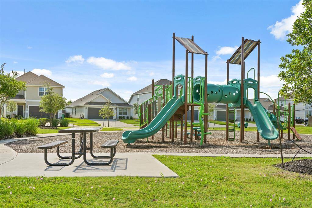 The playground features several patio tables -- an ideal place to keep your kids' water bottles or after-school snacks while they play on the playground.