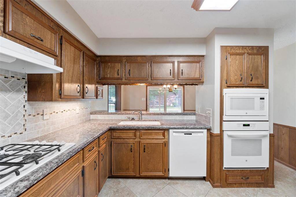 The kitchen is equipped with tons of cabinet space.