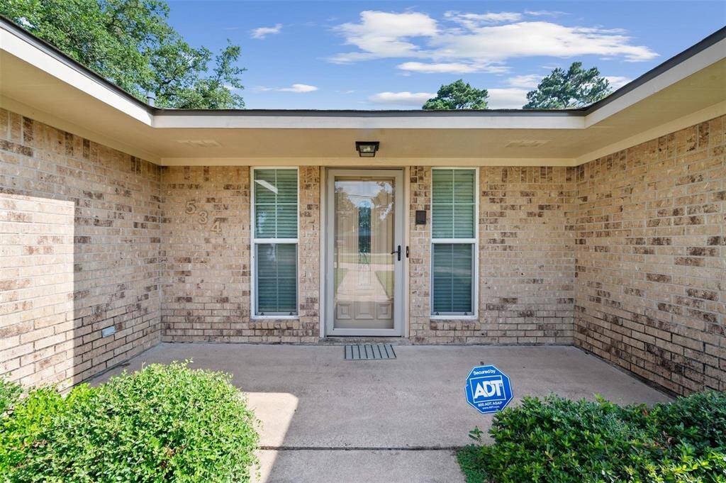 A welcoming, extra-large front patio greets you as you enter the home.