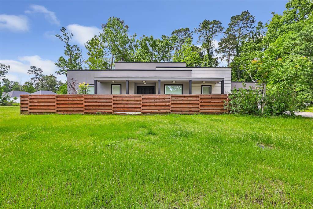 Front of home. Fenced area for pets and privacy. Additional acreage comes with home