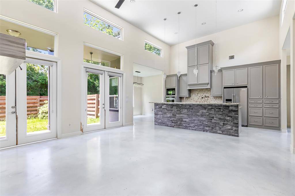 Natural light, high ceilings, stained concrete and an open floor plan