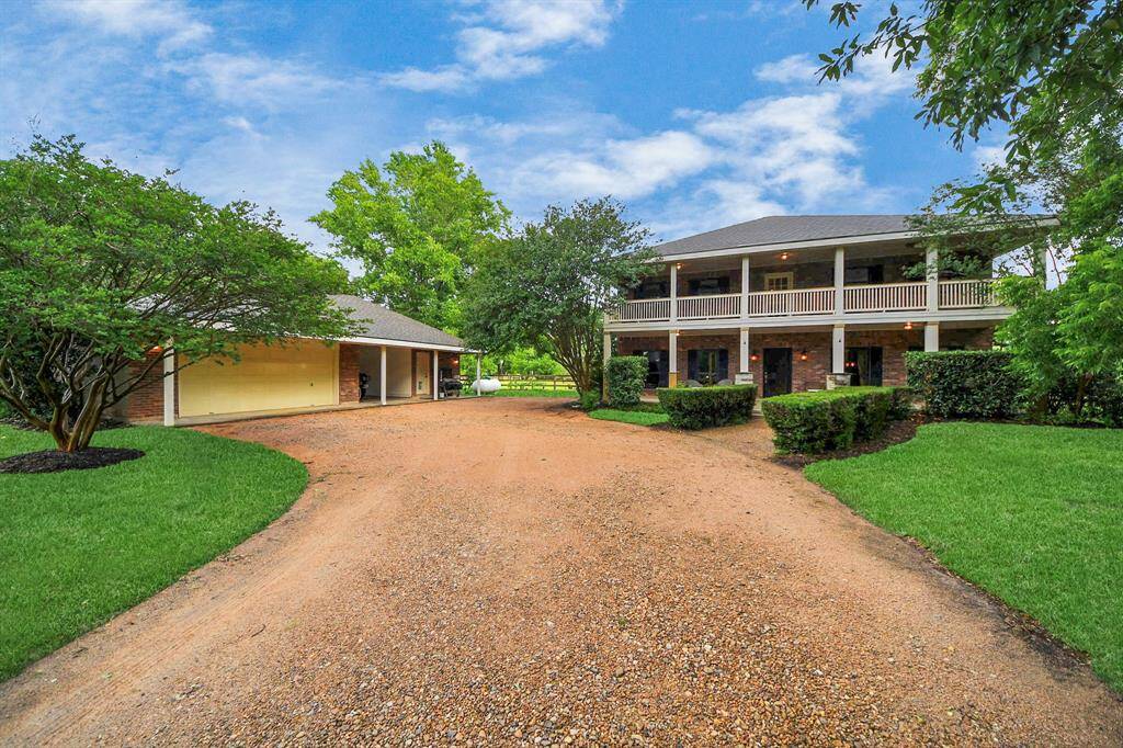 A crushed granite gravel driveway and walkway enhance the home’s rustic country charm, with plenty of room for parking cars, trucks, and all your outdoor toys.
