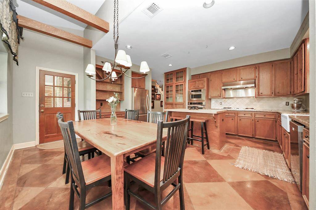 A door in the breakfast room provides easy access to the backyard, perfect for indoor-outdoor living and entertaining.