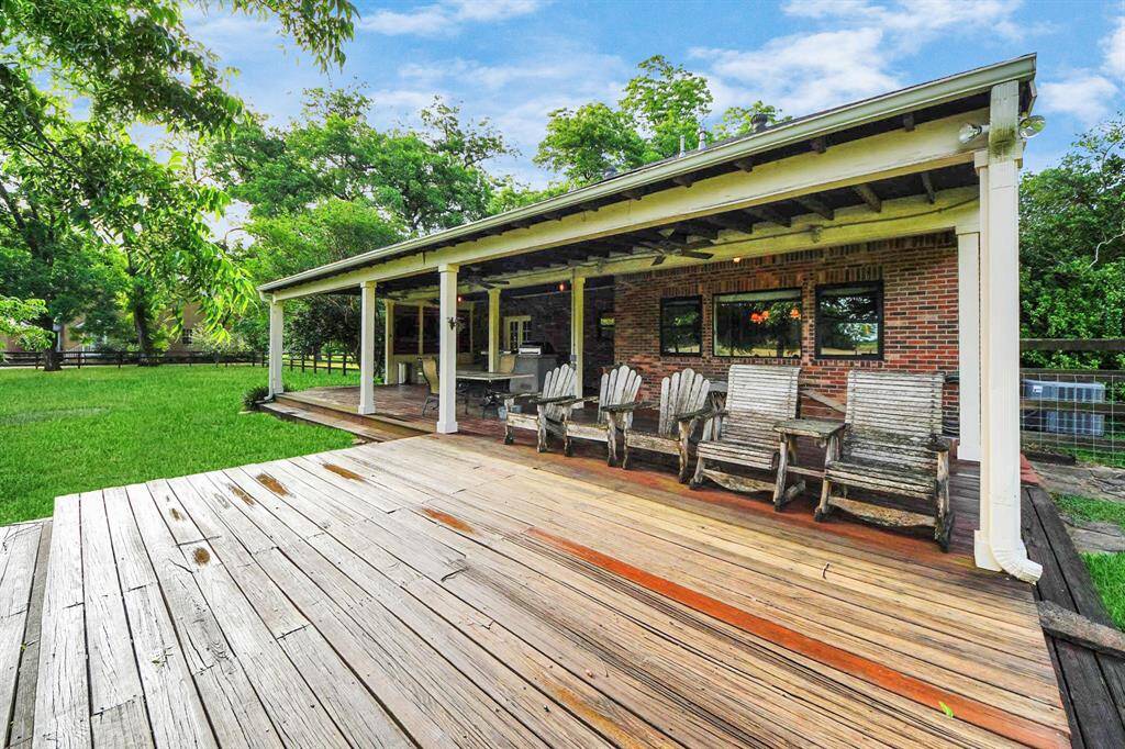 The covered back patio offers a shady retreat, while an extended uncovered deck is perfect for sunning or lounging in Adirondack chairs—all with a view that stretches across your private estate.