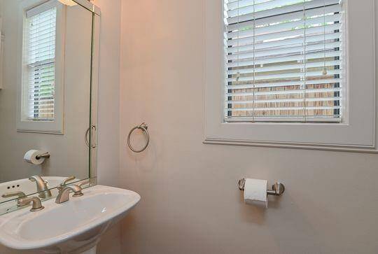 An Elegant half bath is centrally located to all of the downstairs.