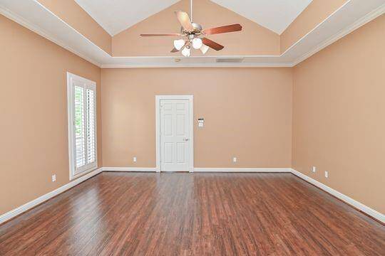 Beautiful recently refinished hardwoods continue into the primary suite.
