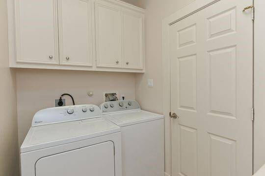 The laundry room has a washer & dryer that remain in the home.