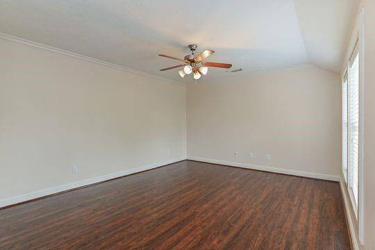 Another large bedroom is located on the 3rd floor and also features beautiful refinished hardwoods & a walk in closet.